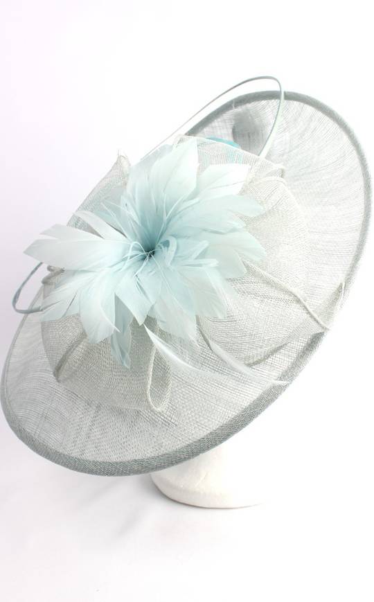 Larger round sinamay hatinator  w floral feature and circular  ice blue feather spheres STYLE: HS/3005 /BLU